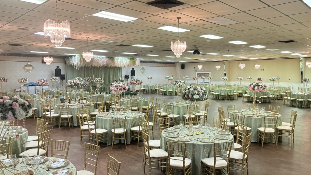 Chiavari chairs set up in a banquet hall for a formal event in Piscataway, NJ with round tables, elegant place settings, and a polished reception layout